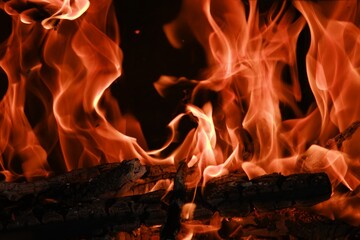 Fire flames from a wood stove fire isolated on a black background