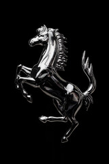 Obraz premium Metal horse on black background..