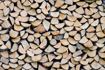 Woodpile. Wall of chopped wood, background of dry chopped wood stacked in pile