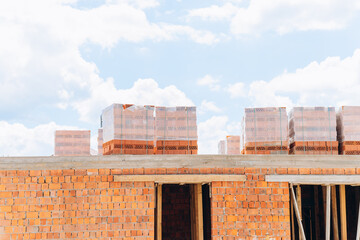 Wall ceramic perforated blocks of red bricks on a pallet