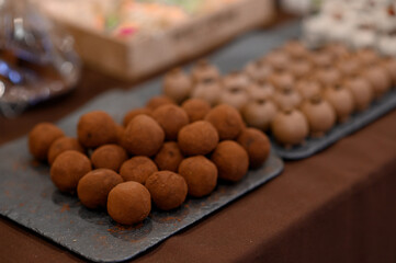 A set of dark chocolate candies for sale.
