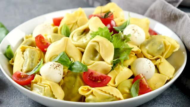 fresh tortellini pasta with tomato and mozzarella