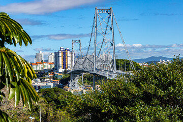 Sunny day view of the Hercilio Luz suspension bridge. The longest suspension bridge in Brazil and...