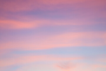 Majestic dusk. Sunset sky twilight in the evening with colorful sunlight. Pastel colors. Abstract nature background. Moody pink, purple clouds sunset sky with long shutter