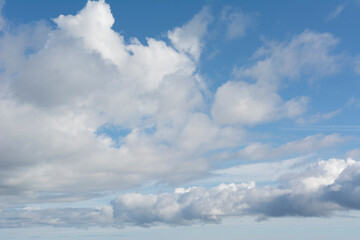 Fototapeta premium Fluffy white clouds and blue sky