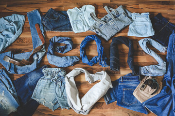 The word jeans made from different denim clothes. Fashion style background. Denim daze. Shopping concept.