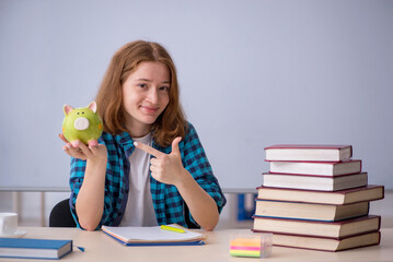 Young female student in expensive education concept