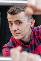 Portrait of a guy in a red checkered shirt