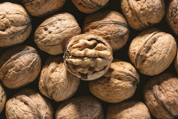 Background of fresh walnuts. Walnuts in shell at the market