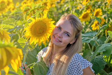 woman in a field of sunflowers