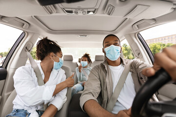 African Family Driving Car Gesturing Thumbs Up Wearing Face Masks
