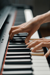 Obraz premium refined woman pianist plays the piano with thin fingers, sensually plays a musical instrument