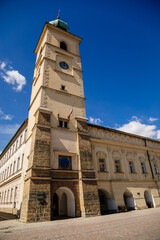 Fototapeta na wymiar Litomysl, Czech Republic, 17 April 2022: old city or town hall with tower on main Smetana Square at sunny summer day, colorful renaissance and baroque buildings in center, picturesque street