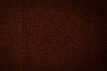 Brown color felt textile fabric material texture background. Abstract monochrome dark brown color background