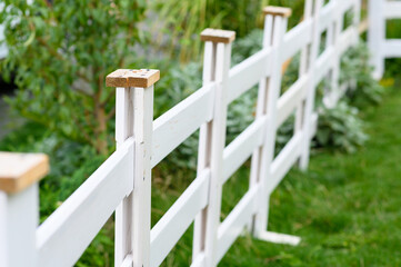 white wooden fence on the grass