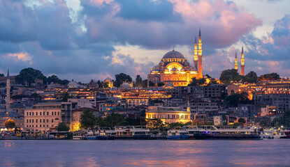 Fototapeta na wymiar Suleymaniye Mosque with night illumination and minaret of Rustem Pasha Mosque, Istanbul, Turkey