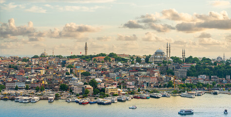 Istanbul panorama with mosque at sunset, aerial view of old town, bridge and Golden horn strait, Turkey