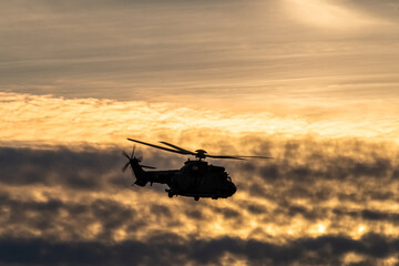 Naklejka na ściany i meble silhouette of a military helicopter
