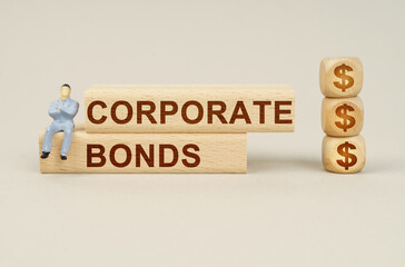 On the blocks with the inscription - CORPORATE BONDS, the figure of a businessman sits, next to the cubes