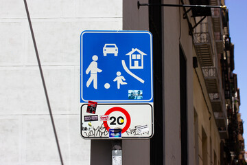 Blue road sign prohibiting fast cars in area where children, schoolchildren play. Prohibiting kids...