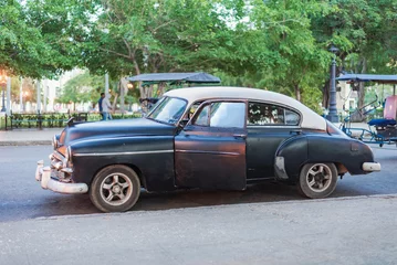 Foto auf Acrylglas old black and white classic car in the street of havana cuba © Michael Barkmann