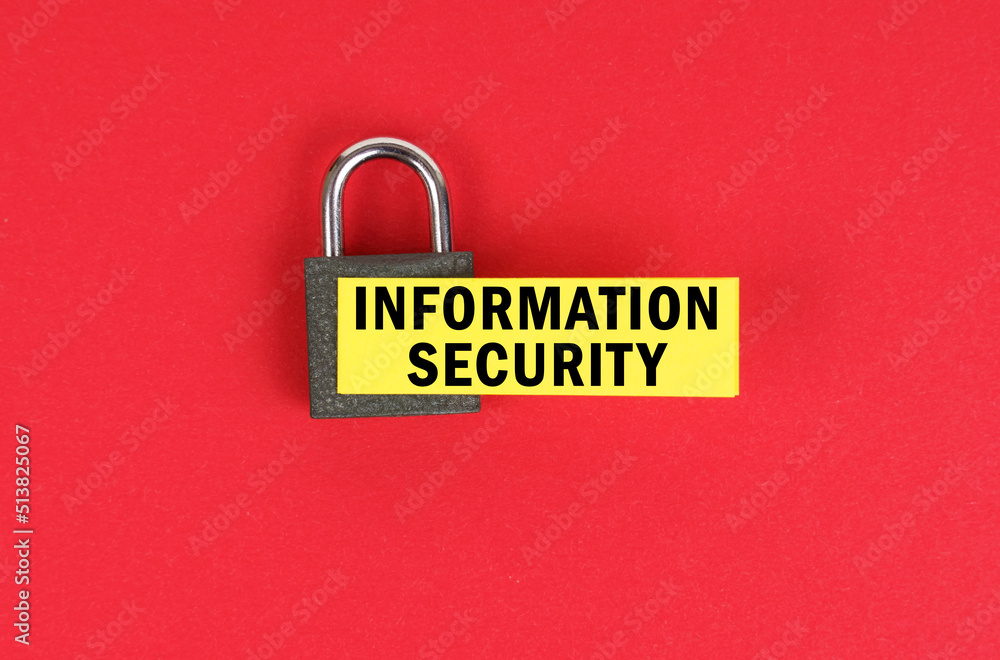 Poster on the red surface there is a lock with a sticker with the inscription - information security
