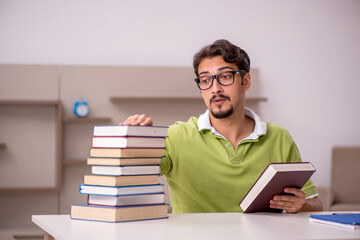 Young male student studying at home