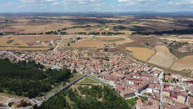 Beautiful city San Esteban de Gormaz situated in province of Soria - Spain. Aerial view of the city and the river Duerdo. The town is located in the Wool Route and the Way of the Cid. Drone forward