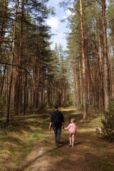 Fototapeta premium Young dad and daughter walk