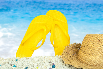 yellow slippers on the beach