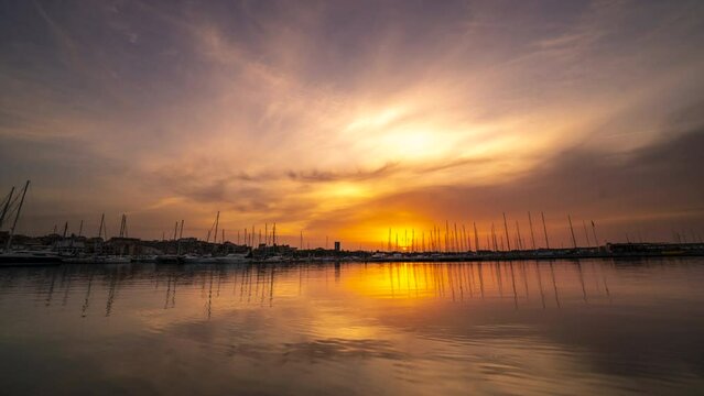 Low Angle Time Lapse of Sun raising on the Clouds Skies of Cambrils
