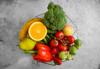 Fresh organic vegetables and fruits on old background
