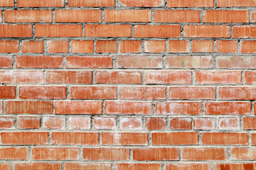 An old damaged brick wall as a background