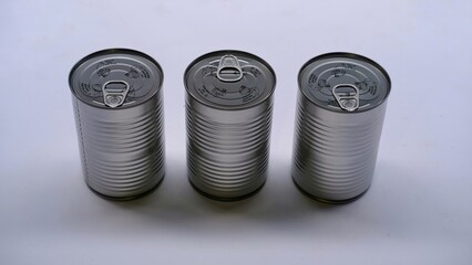 Food cans, detail of a canned food, food conservation, metal food cans isolated on white background