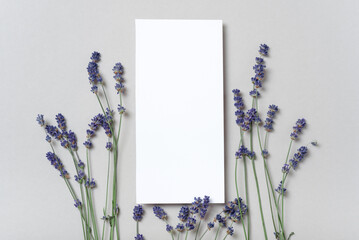 Rectangular vertical or square invitation white greeting card mockup with a flowers lavender...