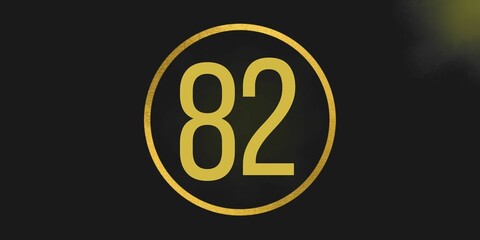 Number 82. Banner with the number eighty two on a black background and gold details with a circle gold in the middle