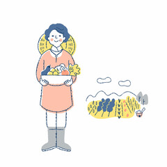 収穫物を持っている野菜農家の女性と畑