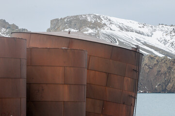 Rusty containers litter the Antartica landscape