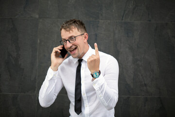 businessman talking on the phone. Happy man. Yes. Gesture. Man business concept. Working. Work. 