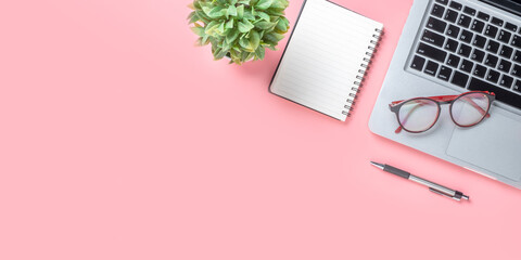 Top view, Blue Office desk with computer, Pen, eyeglass and notebook, copy space, Mock up..