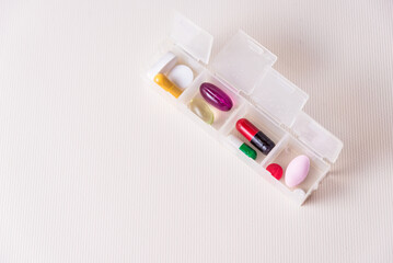 pills sorted in a pillbox, medicinal, pandemic, health and wellness concept