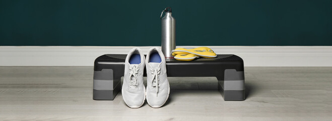 Step platform and different sports equipment indoors. Banner design
