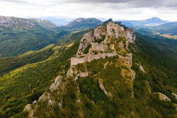 Ruins of Cathar castle of Peyrepertuse perched on rocky ridge. France