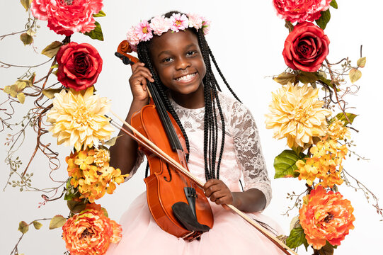 African American Girl Playing The Violin. 