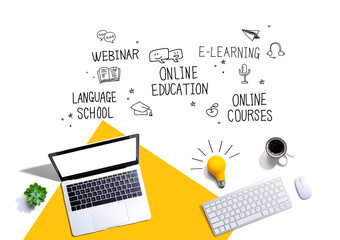 Online education theme with computers and a light bulb