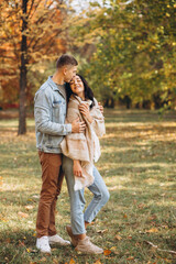 Fototapeta premium Happy couple together in the autumn park