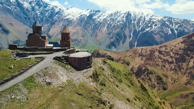 aerial view of Gergeti Trinity Church and Stepantsminda, Georgia. High quality 4k footage