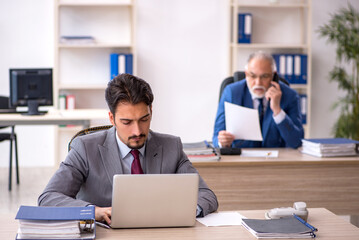 Two male colleagues working in the office