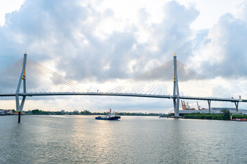 Fototapeta premium Transport boats on the Chao Phraya River near Bhumibol Bridge, Bangkok, Thailand