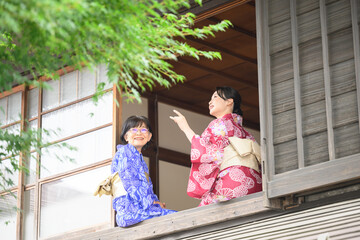 Japanese parents and children enjoying themselves in yukata